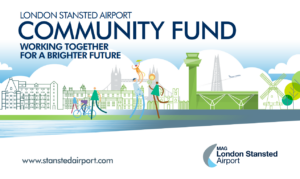 A promotional banner for the London Stansted Airport Community Fund featuring a colourful vector illustration of regional landmarks and community activities.