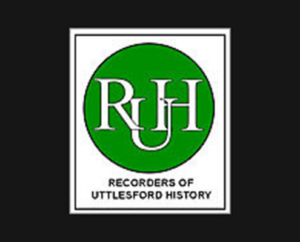 The logo for the Recorders of Uttlesford History, featuring a green circle containing a white "RUH" monogram above black text inside a white rectangular frame.