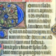 A close-up of a medieval illuminated manuscript page featuring an intricate blue and gold initial letter "D" and Latin Gothic script.